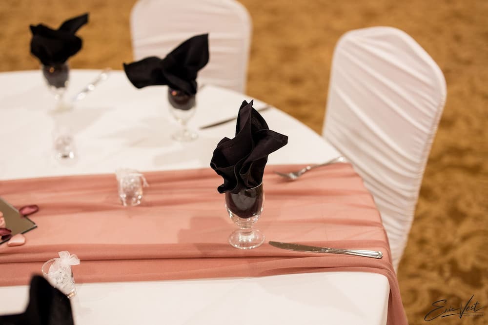 Pink table with black napkins event